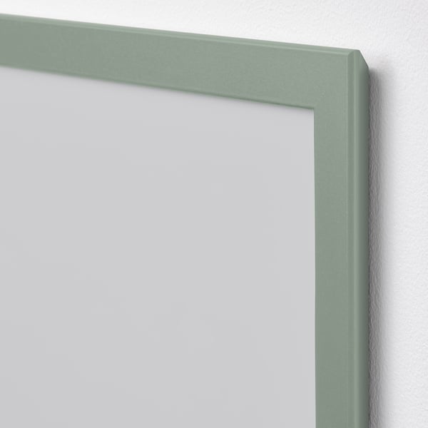 Green picture frame, well-crafted, mounted on wall, high quality, clean design