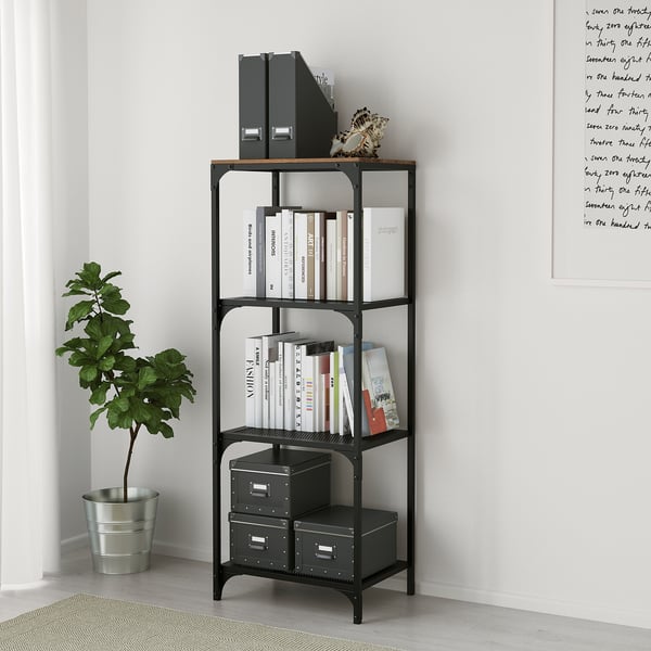 Modern metal and wood bookshelf with adjustable feet, holding books, binders, and boxes, next to a potted plant.