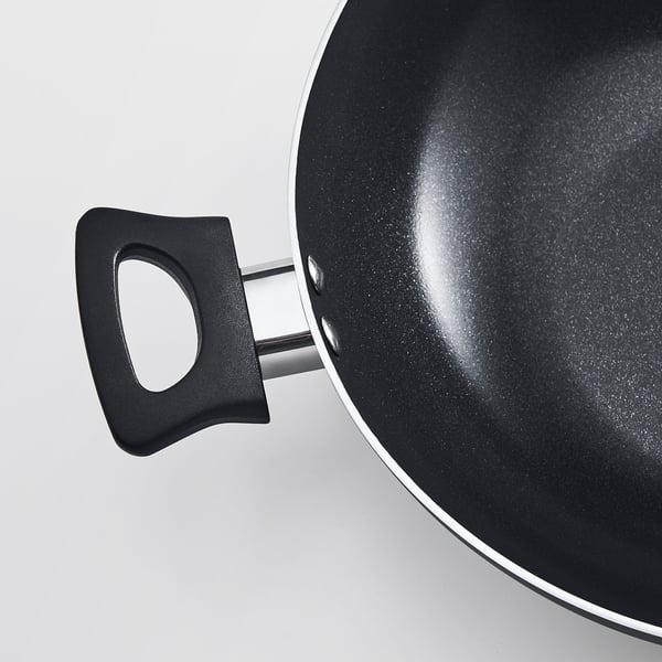 Black wok with black handle, sol-gel ceramic coating, smooth non-stick surface.