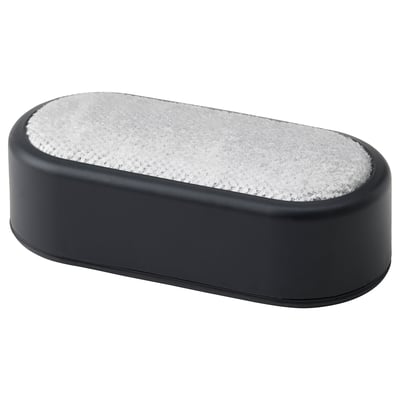 FRUKTPLOCKARE lint brush - small black oval tool with grey bristles for removing hair and lint from clothes.