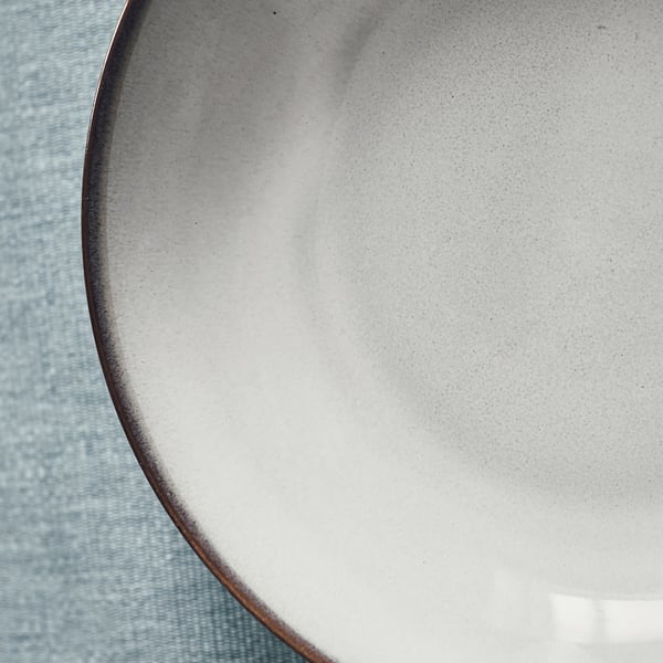 Deep glazed plate, pristine & textured.