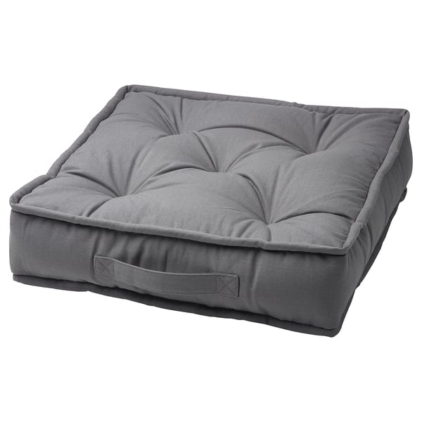 A grey GURLI floor cushion. Its square-shaped with a soft, quilted design and made from sustainable cotton and recycled polyester.
