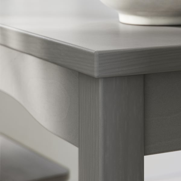 Grey rectangular wood dining table edge