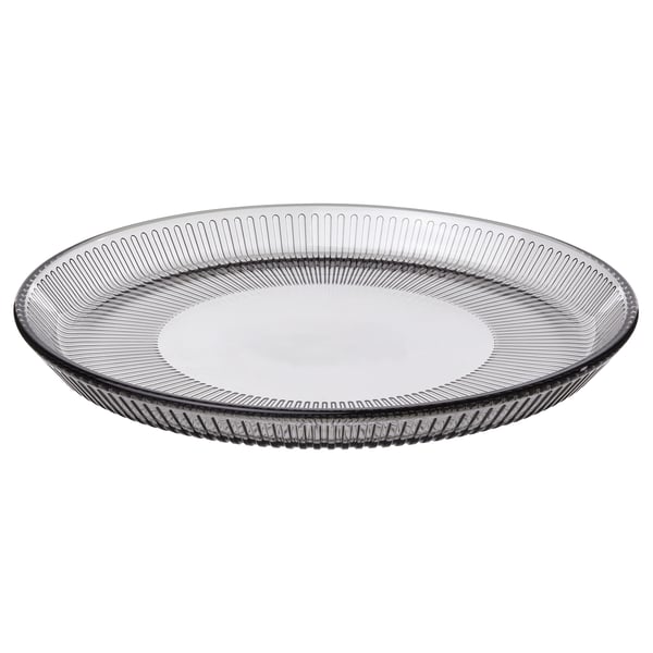 Round grey glass plate with vertical line design.