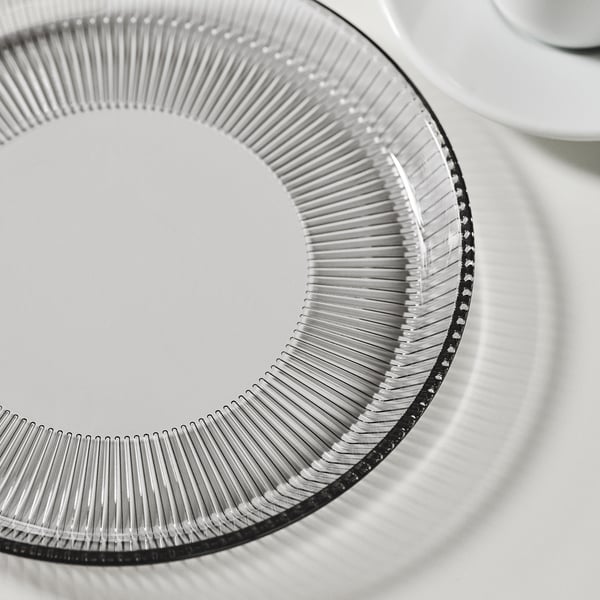 Intricate, patterned glass plate, finely detailed, stackable design.