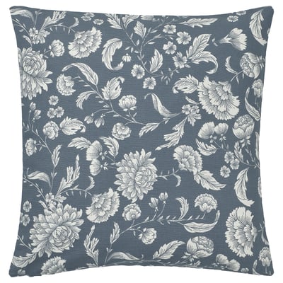 Square blue pillow with white floral pattern.