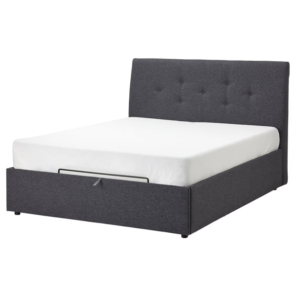 Idsane upholstered bed in grey with tufted headboard and underbed storage.