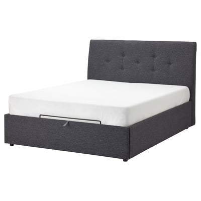 Idsane upholstered bed in grey with tufted headboard and underbed storage.