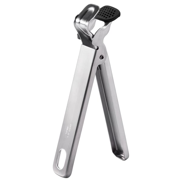 Silver stainless steel kitchen tool with black silicone pad, v-shaped handles, ideal for gripping and opening.
