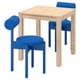 IKEA PS 2026 set: light wood table, two blue upholstered stools with cylindrical backs.
