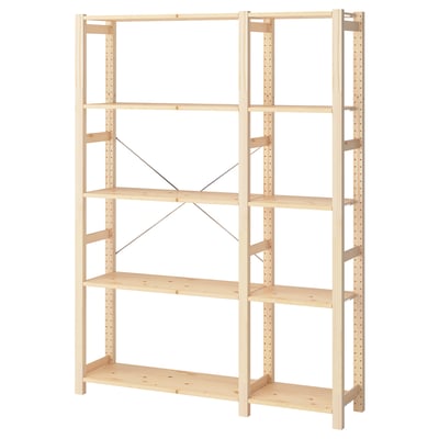 The IVAR wooden shelf unit in natural finish, made of solid pine, with adjustable shelves and steel braces.