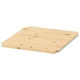 An IVAR wooden shelf, light brown, square, and simple in design, made of solid pine.
