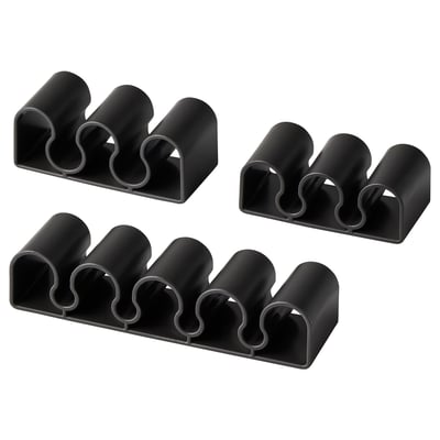 Black KALKSTUFF cable holders in various sizes, arranged in a square.