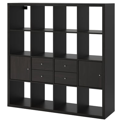 A black KALLAX shelving unit with drawers and cubes for storage. Its modern design includes empty compartments and drawers with round handles.