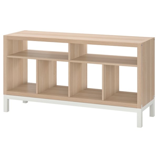 Is of a light brown wooden KALLAX tv bench with open compartments and a metal underframe, set against a white background.