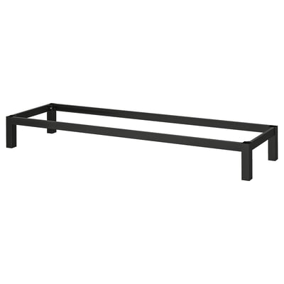 A black KALLAX underframe made of metal, featuring a rectangular shape with four legs, designed to elevate and support shelving units.