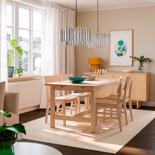Dining area with KARSKÄR table, chairs, bench, modern light fixture, curtains, plants, and artwork.