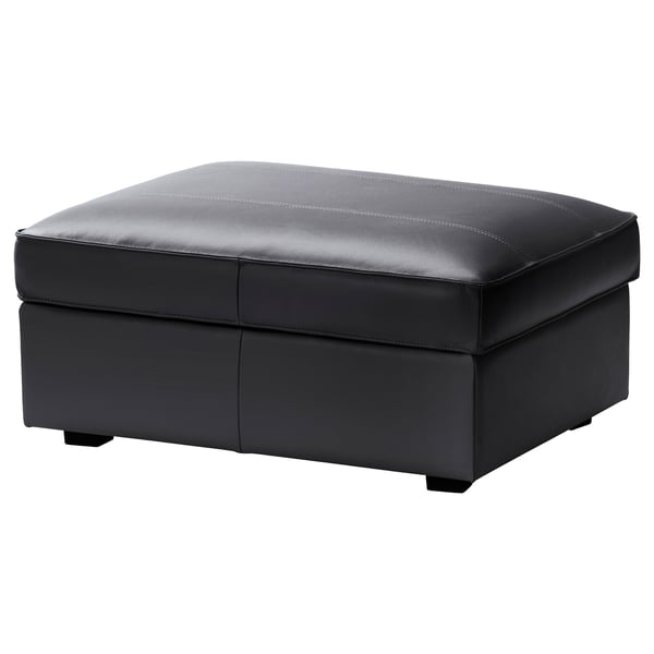 A KIVIK grey leather footstool, rectangular with clean lines and stitching details, providing both comfort and storage.