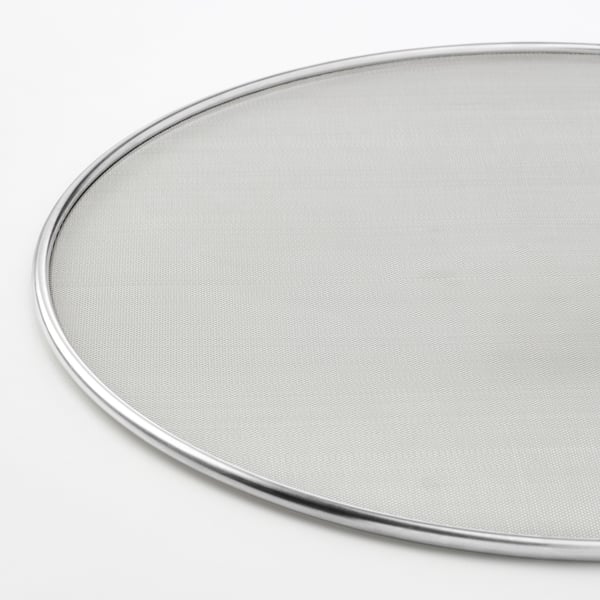 Round stainless steel splatter screen, finely meshed, sits securely on pans to prevent cooking splatter.