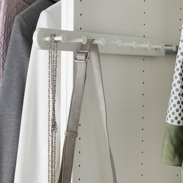 White wardrobe accessories organiser with 8 hooks holding belts and jewellery.
