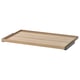 An ikea KOMPLEMENT pull-out tray in light oak color, designed for wardrobe storage, with a wooden and metal design.
