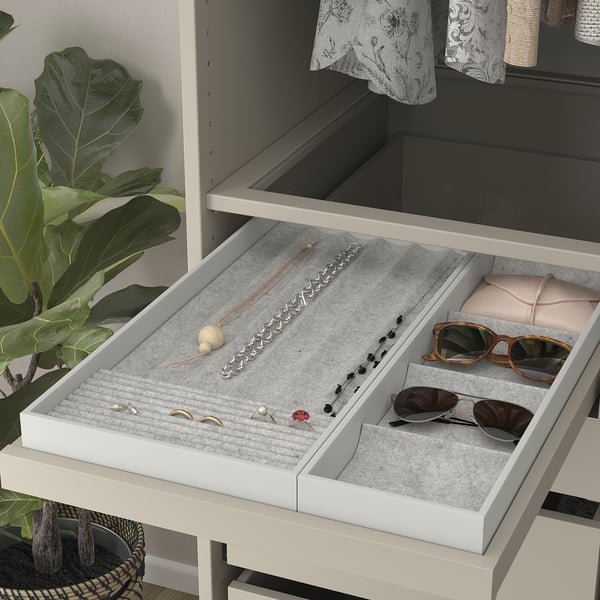 Jewellery tray with compartments; pulls out for easy access.