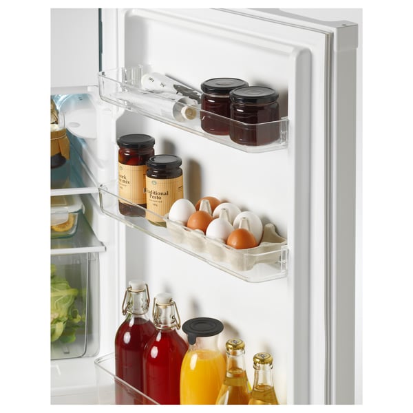 Adjustable fridge shelves with snacks and drinks.