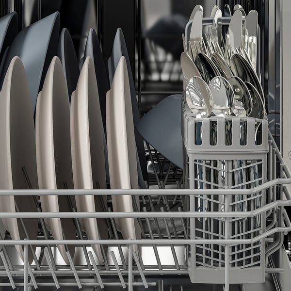 Clean dishes in rack, silverware organised in holder. Dishwasher finished cycle, ready for unload.