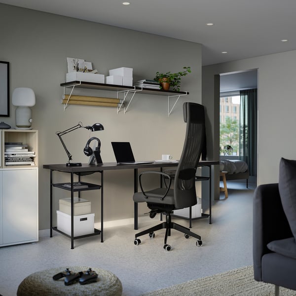 Modern home office featuring LAGKAPTEN desk in grey with mesh chair, black lamp, and storage.
