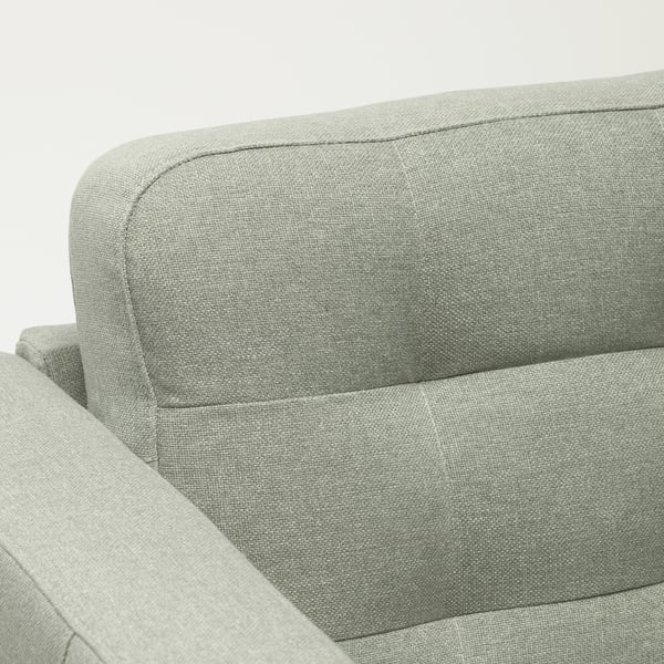 Light grey fabric sofa with thick cushions, neatly stitched, showcasing warm and welcoming design, ideal for comfort and style.