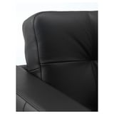 A sleek, black leather armchair section, showcasing smooth, high-quality grain leather and sturdy construction for comfort.