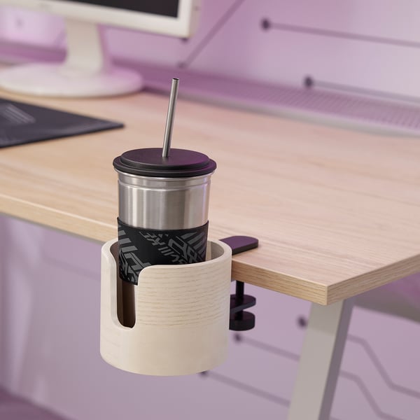 Mug holder on desk with insulated cup.
