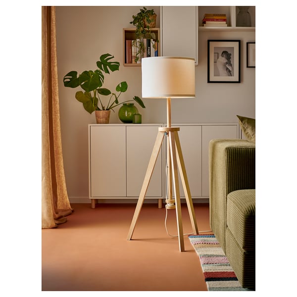 LAUTERS recycled pet lamp in room with beige walls, ash base, cream cabinet, green chair, multi-rug, plant.