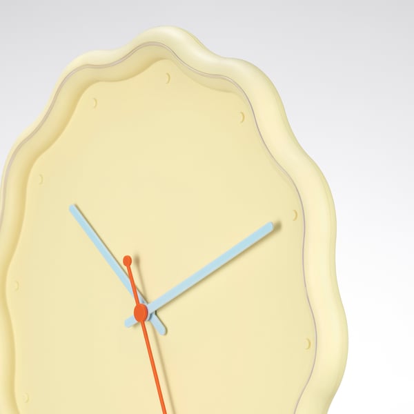 Unique clock with irregular shape, blue hands, orange centre axis, smooth texture.