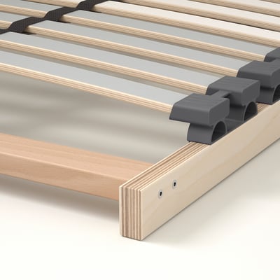 Close-up of sturdy wooden bed slats with grey supports, showcasing quality construction.
