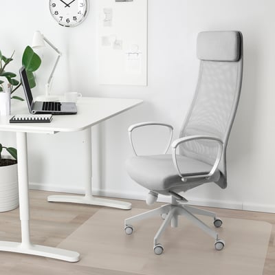 White MARKUS office chair with mesh back, high back, armrests, and caster wheels.