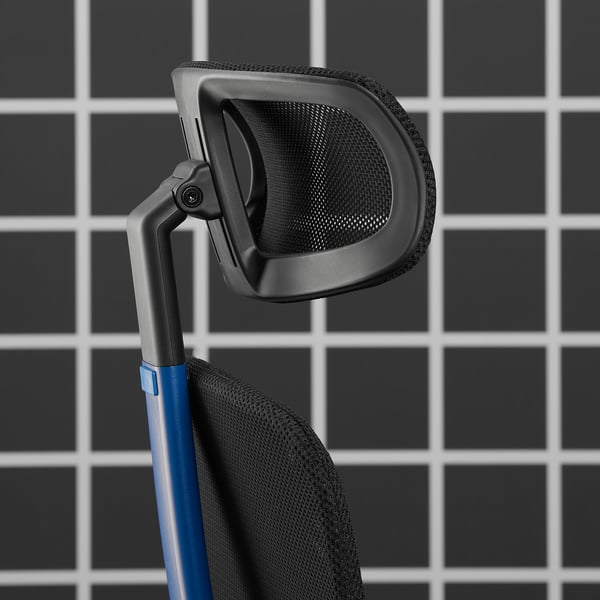 Ergonomic gaming chair detail, showcasing adjustable headrest, mesh back for breathability, and sturdy armrests.
