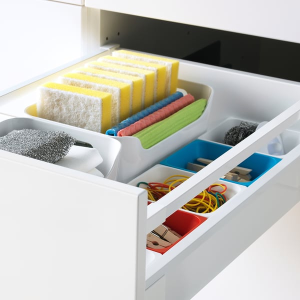 Drawer with sponges, rubber bands, clips, blue/green trays, fully extends, quiet close.