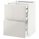 White METOD kitchen cabinet with glossy drawers.