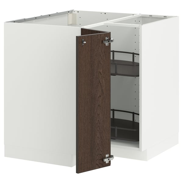 White kitchen cabinet with dark brown door, shelves, and metallic hinges.