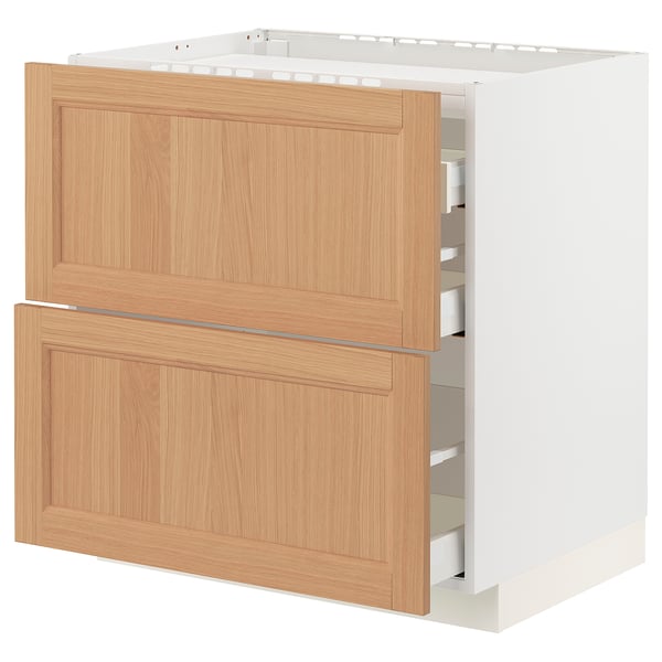 A METOD kitchen cabinet with an oak finish. It wooden drawers and a robust frame, designed for durability and storage.
