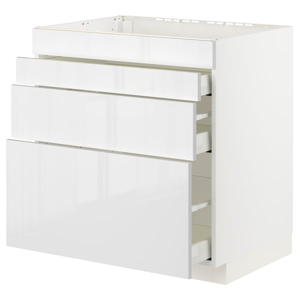 Modern white gloss METOD kitchen cabinet with three drawers.