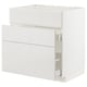 A white METOD kitchen cabinet with high gloss, smooth drawer fronts. It has a sleek, modern design with a clean, minimalist look.
