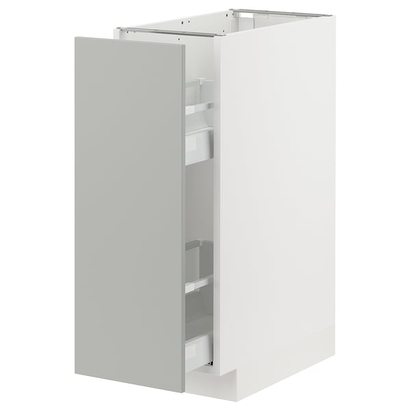 A modern white kitchen cabinet with a pull-out shelf. It sleek, light grey havstorp doors and offers a minimalist design.