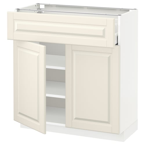 A white METOD kitchen cabinet with bevelled edges, off-white bodbyn fronts, and adjustable shelves.