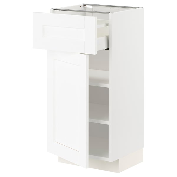 White METOD kitchen cabinet with adjustable shelves and pull-out drawer.