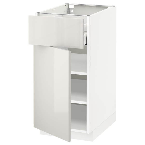 White METOD kitchen cabinet with glossy finish and adjustable shelves.