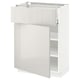 A white METOD kitchen cabinet, sleek and modern with a glossy finish and adjustable shelves.