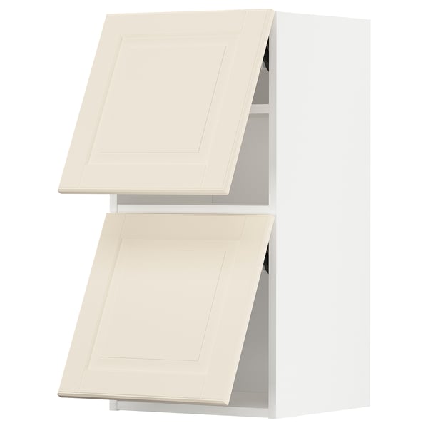 Two white off-white bevelled cabinet doors, open.