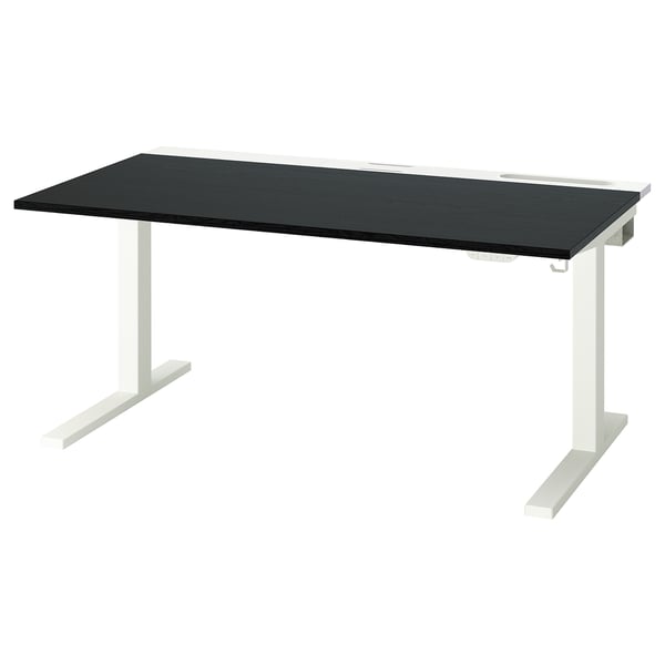 Modern desk with black top and white legs. Sit-to-stand adjustable. Minimalist and functional design.